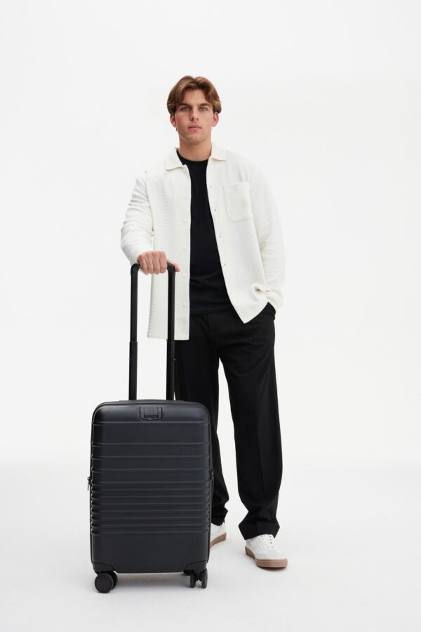 BEIS124671-CarryOnRoller-BLACK-Model_0398.jpg The Carry-On Roller in All Black