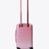 The Small Carry-On Roller in Wicked Pink