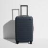 The Bigger Carry-On Flex in Navy Blue